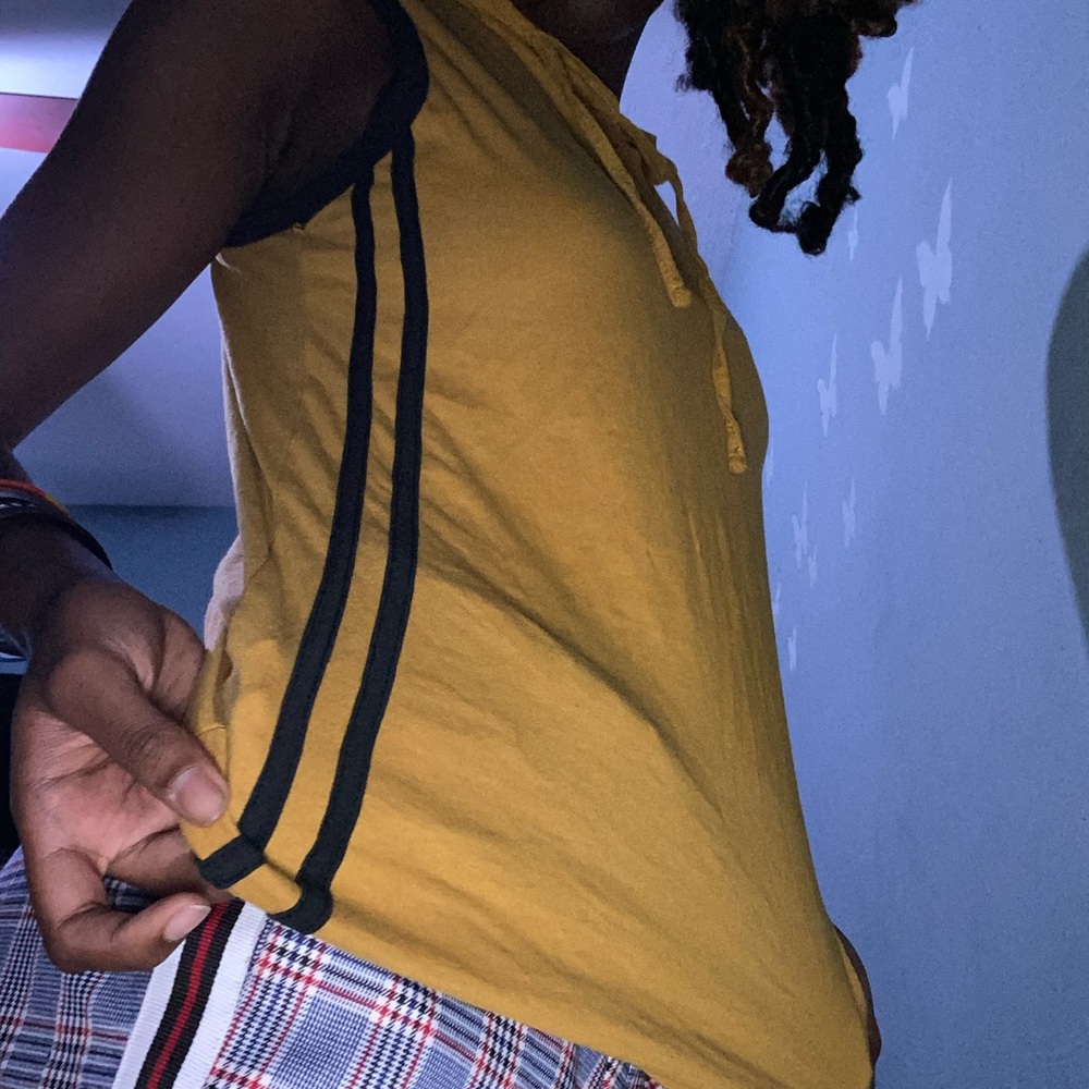 a mustard yellow shirt